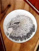 bad eagle inlay su supporto in dente di ippopotamo fossile su riser di arco  ricurvo
